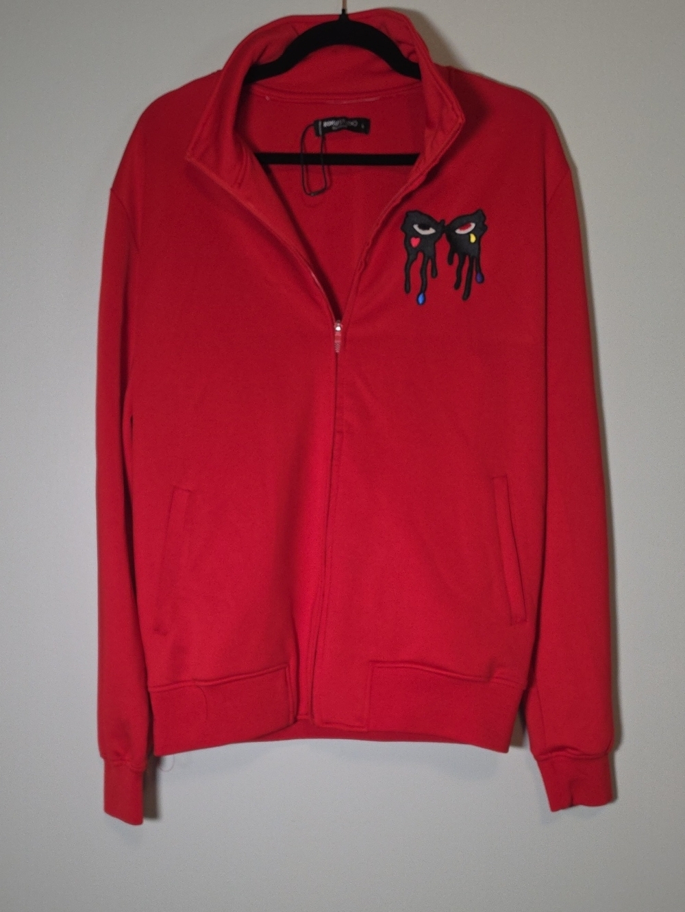 Roku Studio Bright Red Pullover with Black Dripping Eye Patch